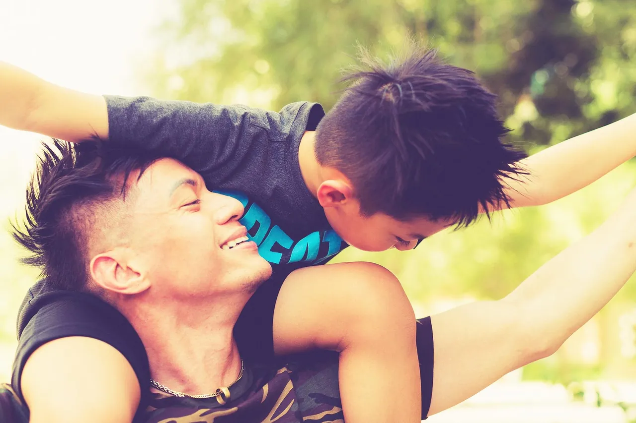 Two friends sharing a playful moment outdoors
