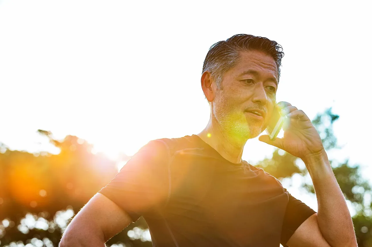 Man laughing in the sunshine