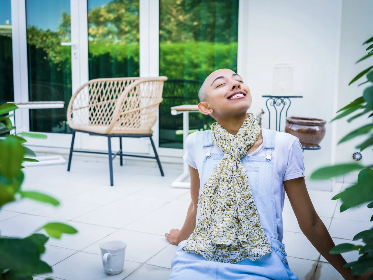 Woman relaxing on a bright terrace