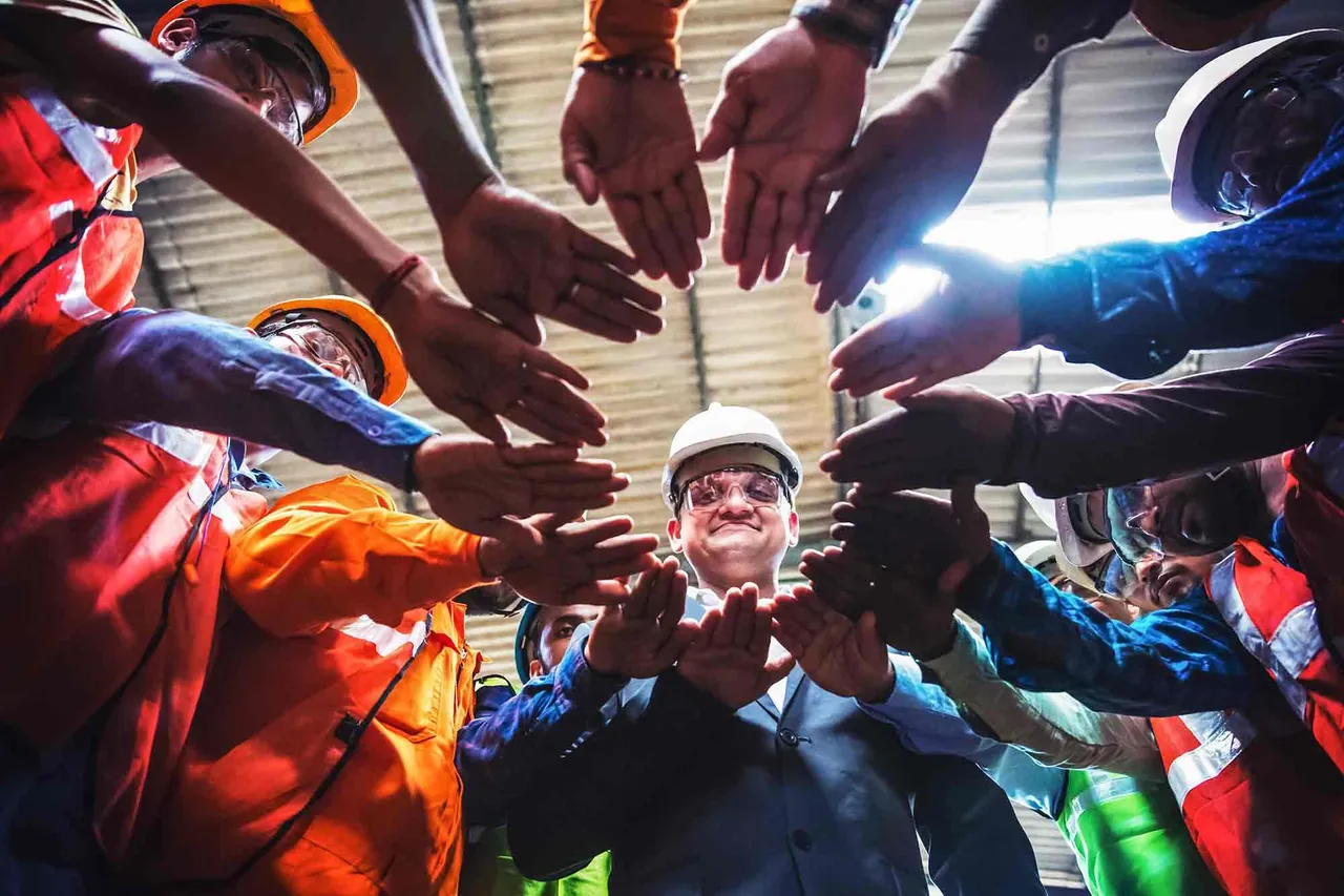 Team joining hands in a circle